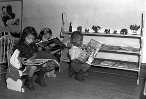 Children looking at picture books, Hallie Q. Brown Nursery School, St. Paul.