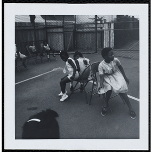 The participants playing musical chairs during a Boys' Club Little Sister Contest