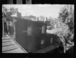 [Untitled photo, possibly related to: Old wooden shacks on left of picture inhabited by whites and Negroes. Many of these houses have no inside water supply or toilet. Washington, D.C.]