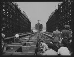 Production. Launching of the SS Booker T. Washington. The SS Booker T Washington, first Liberty Ship named for a Negro, enters the water after  being launched at the Wilmington, California, yards of the California Shipbuilding Corporation on September 29, 1942