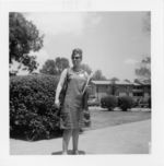 Mississippi State Sovereignty Commission photograph of a woman wearing sunglasses and standing on a sidewalk during a training session for COFO volunteers in Oxford, Ohio, 1964