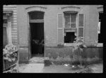 Front of Negro home near Capitol, Washington, D.C. Interiors of these homes vary little. A chair or two and a table, a bed and perhaps an extra mattress on the floor cares for six to ten people