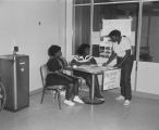 Students at the freshman voting table during campus elections at Tuskegee Institute in Tuskegee, Alabama.