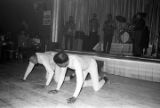 Two male dancers performing on the floor in front of the stage at the Laicos Club in Montgomery, Alabama.