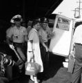 Police officers arresting Salynn McCollum after the Freedom Riders arrived at the Greyhound station in Birmingham, Alabama.