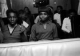 Marion Sledge and a young woman seated on the bus for Bobby Moore and the Rhythm Aces, after a performance by the group at a dance at the National Guard Armory on Dallas Avenue in Selma, Alabama.