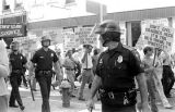 Police officers and Klansmen at a United Klans of America march in Mobile, Alabama.