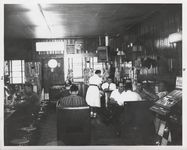 Mississippi State Sovereignty Commission photograph taken inside of Stanley's Cafe showing a waitress and men eating while seated at tables, booths and counter, Winona, Mississippi, 1961 November 1