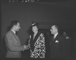 First lady inspects war workers homes. On an inspection tour of federal dormitories for war workers in Washington, D.C. on May 18, Mrs. Eleanor Roosevelt visited four projects recently erected for Negroes. Shown greeting the First Lady at George Washington Carver Hall, residential hotel for Negro men, is Hillyard Robinson, architect who designed the building. Looking on is W. Spurgeon Burke, resident manager of both Carver Hall and the Lucy Slowe Hall, residential hotel for Negro women war workers