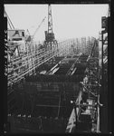 Baltimore, Maryland. Building the SS Frederick Douglass. A general view of the ship looking towards stern, as it appeared one week after the hull was laid. More than 6,000 Negro shipyard workers are employed at the Bethlehem-Fairfield shipyards, where the Liberty ship is being rushed to completion. The noted orator and abolitionist leader once worked as a caulker in the vicinity of this shipyard before he escaped from slavery