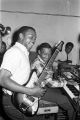 Mark Williams (guitar), Willie Green (keyboard), and Frank Flowers (bass) performing at Tom's Place at 648 South Holt Street in Montgomery, Alabama.