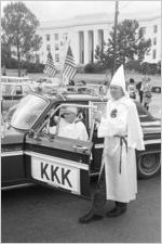 Two Klansmen at car during a Ku Klux Klan rally in Montgomery, Alabama.