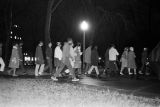 Demonstrators marching toward the Jefferson County Courthouse in downtown Birmingham, Alabama, for a nighttime voter registration rally.