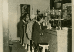 Customers seated at restaurant counter