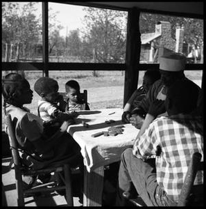 Oliver Jacobs Playing Dominoes with His Grandchildren