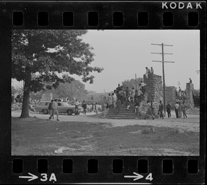 People standing on stairs of Elma Lewis Playhouse at Black student rally in Franklin Park
