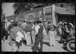 Some of the Negroes watching itinerant salesman selling goods from his truck in center of town. On Saturday afternoon. Belzoni, Mississippi Delta, Mississippi