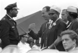 Policeman talking to a man among the mourners at Martin Luther King, Jr.'s funeral.