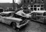 Damaged car in the street after the bombing of 16th Street Baptist Church in Birmingham, Alabama.