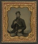 [Unidentified soldier in Union uniform with fife in front of painted backdrop showing a pastoral landscape]