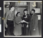 Charlotta Bass talks to three students at the offices of the California Eagle, circa 1941/1950, Los Angeles