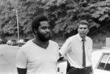 Lieutenant Doug Acker escorting Anthony Ray Hinton to the city jail in Bessemer, Alabama.