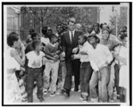 [Attorney General Robert Kennedy surrounded by African American children at the Morningside Community Center in Harlem]