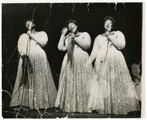 Triple-image (triple-exposure) picture of Ella Fitzgerald in concert, undated.] [Black-and-white photoprint.