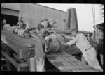 Negro stevedores handling drums, New Orleans, Louisiana