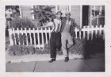 Melvin Rhoades and Henry Barnard Leaning Against Fence, ca. 1950's