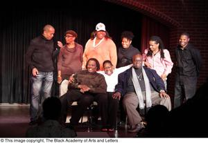 Nine people on stage including Curtis King