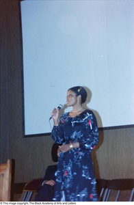 Female artist giving lecture at conference