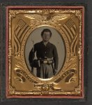 [Unidentified soldier in Union uniform with bayoneted musket, revolver, cap and cartridge boxes, and bayonet in scabbard]