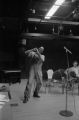 Etheridge Knight: Oxford, Miss. Knight performing at microphone in front of small audience (EKP 2-79-12/11 #295)