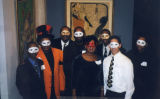 Members of the Ethnic Alumni Association wear masks at a social event, 2000