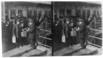 A representative of the New York Bible Society distributing bibles and religious literature to the emigrants at Ellis Island, New York City