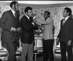 Muhammad Ali and Sugar Ray Robinson sparring in jest, Los Angeles