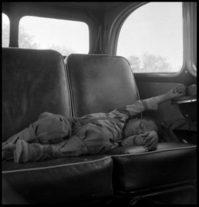 Child Sleeping in a Car