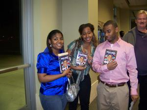 A group of students holding DVDs, 1