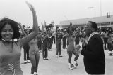 Erskine Hawkins conducting the Carver High School marching band after arriving at the airport in Birmingham, Alabama.