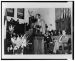 [Clarence Mitchell, half-length portrait, standing in front of lecturn in church, facing left]