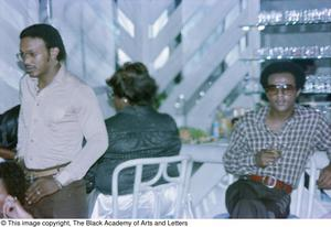 Photograph of Larry Whittington and other guests sitting in chairs