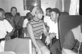 Members of Bobby Moore and the Rhythm Aces seated on the group's bus after a performance by at a dance at the National Guard Armory on Dallas Avenue in Selma, Alabama.