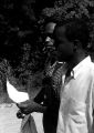 Thumbnail for Edward Rudolph and another man, reading a sheet of paper while leading marchers down a street in Prattville, Alabama, during a demonstration sponsored by the Autauga County Improvement Association.