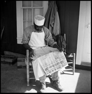 Oliver Jacobs Reading on Bunkhouse Porch