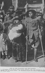 One of the wounded [a member of the famous 369th Colored Infantry] and his mother