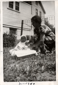 Lee Harris sitting on lawn with his grandmother, Nana