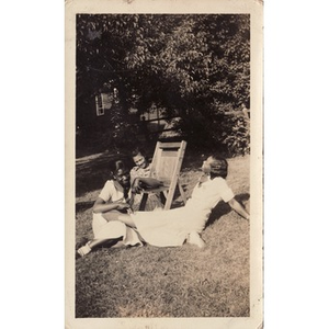 Inez Irving and friends recline on the lawn