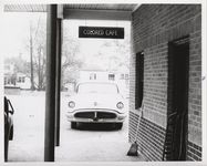 Mississippi State Sovereignty Commission photograph of a sign reading "Colored Cafe" outside the rear entrance to Stanley's Cafe, Winona, Mississippi, 1961 November 1