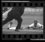 Maury Wills sliding into first base during Los Angeles Dodgers game in 1965